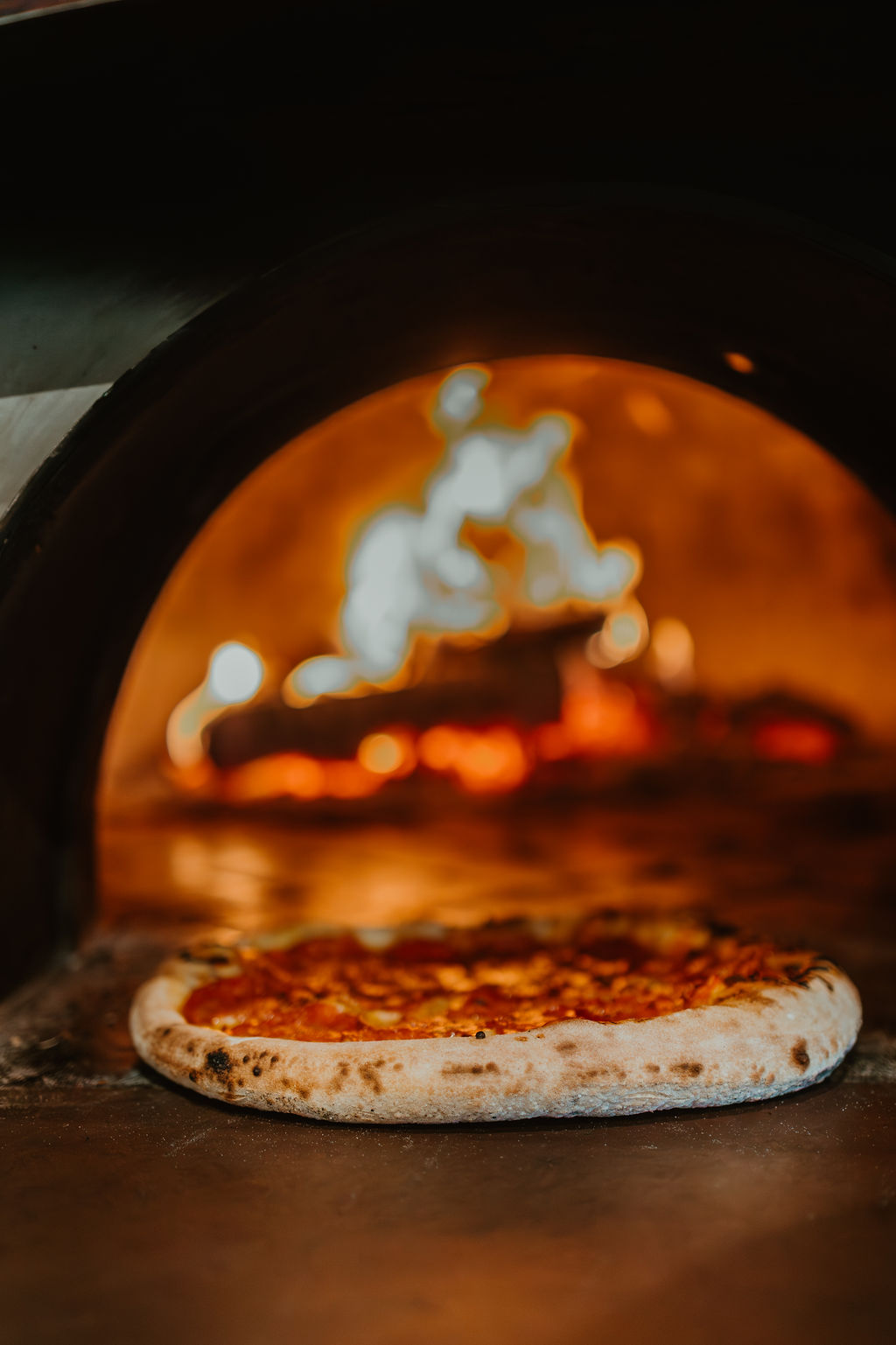 Wood-fired pizza at Bravo Americano Moderno